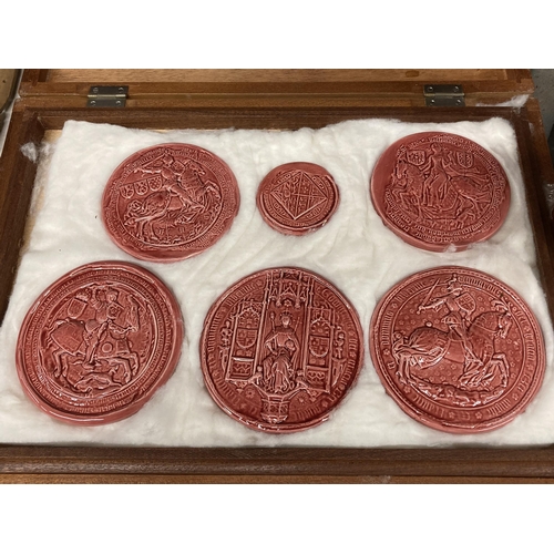 880 - A BOX SET OF MEDIEVAL STYLE POTTERY PLAQUES