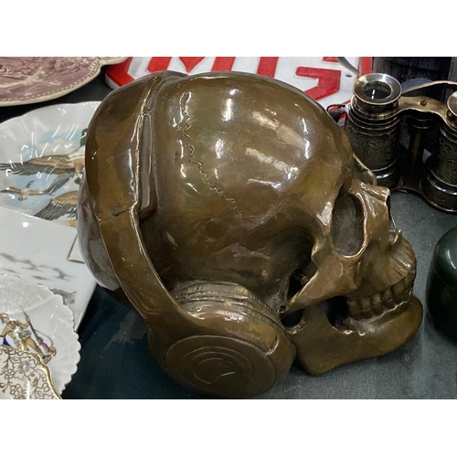 288 - A BRONZE SKULL WITH HEADPHONES