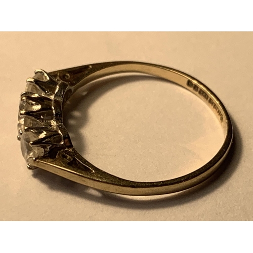 503 - A 9 CART GOLD RING WITH THREE IN LINE CUBIC ZIRCONIAS SIZE K