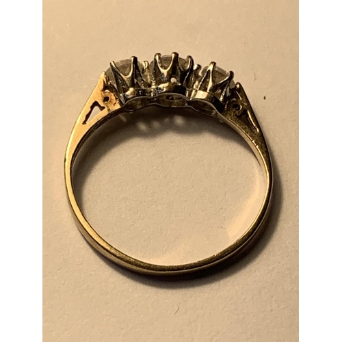 503 - A 9 CART GOLD RING WITH THREE IN LINE CUBIC ZIRCONIAS SIZE K