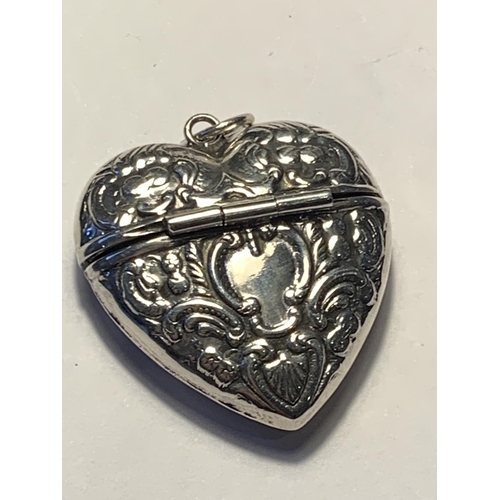 513 - A MARKED SILVER HEART SHAPED CASE