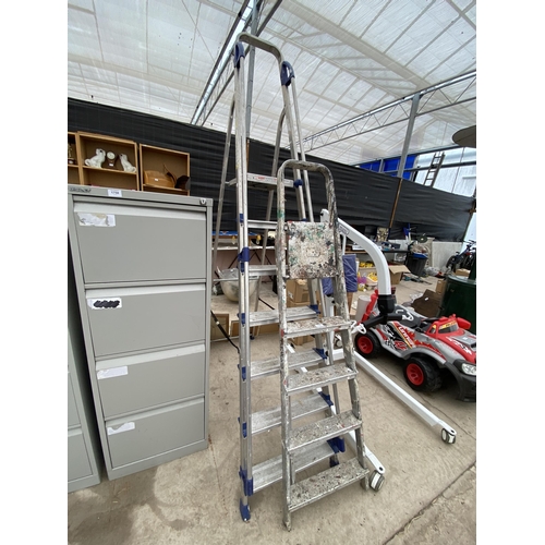A LARGE 6 RUNG ALUMINIUM ABRU STEP LADDER AND A FURTHER 4 RUNG