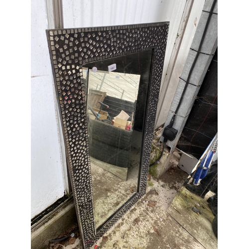 1987 - A DECORATIVE FRAMED WALL MIRROR