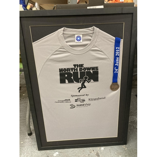 897 - THREE FRAMED AND GLAZED WINNERS SHIRTS AND MEDALS FROM THE NORTH DOWNS RUNS