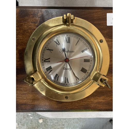 900 - A MAHOGANY FRAMED BRASS PORTHOLE STYLE CLOCK AND BAROMETER