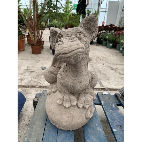 75 - A CONCRETE GARDEN ORNAMENT IN THE FORM OF A DRAGON SITTING ON AN EGG NO VAT