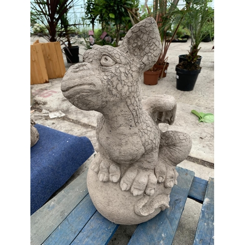 75 - A CONCRETE GARDEN ORNAMENT IN THE FORM OF A DRAGON SITTING ON AN EGG NO VAT