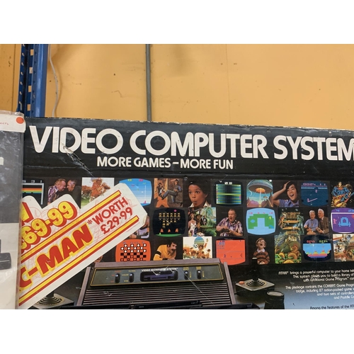 406 - AN ATARI VIDEO COMPUTER SYSTEM, BOXED WITH INSTRUCTIONS AND GAMES