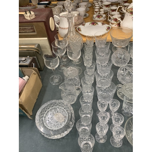 421 - A LARGE QUANTITY OF GLASSWARE TO INCLUDE A DECANTER, JUGS, BOWLS, VASES, PORT GLASSES, WINE, TUMBLER... 