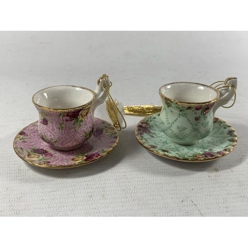 752 - TWO ROYAL ALBERT BOXED MINATURE TEACUP AND SAUCER ORNAMENTS - DUSKY PINK AND PEPPERMINT