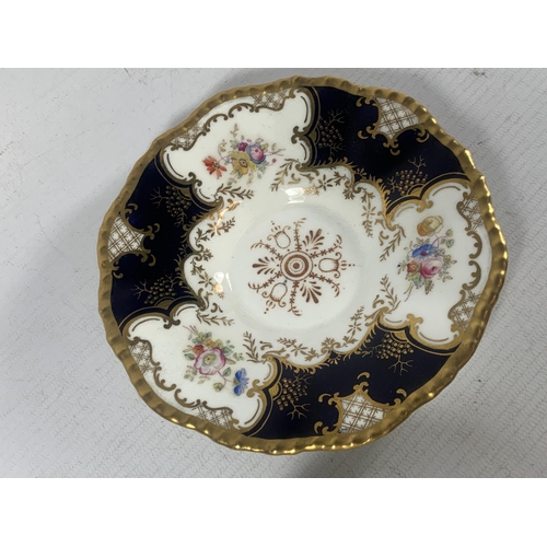 753 - A COALPORT BATWITN PANEL COBALT GOLD FLORAL CUP AND SAUCER