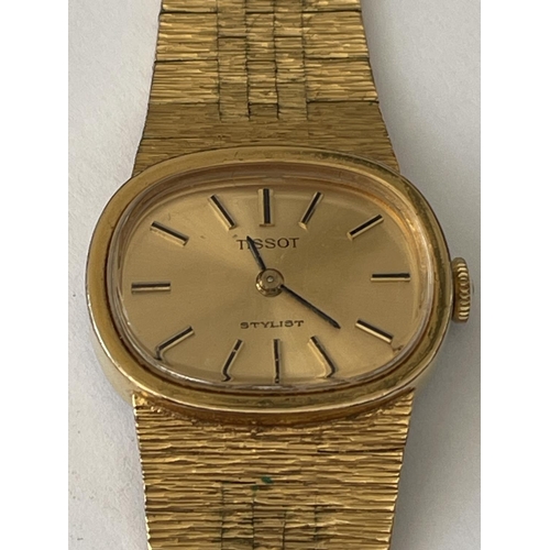 632 - A TISSOT WRISTWATCH WITH YELLOW METAL STRAP SEEN WORKING BUT NO WARRANTY