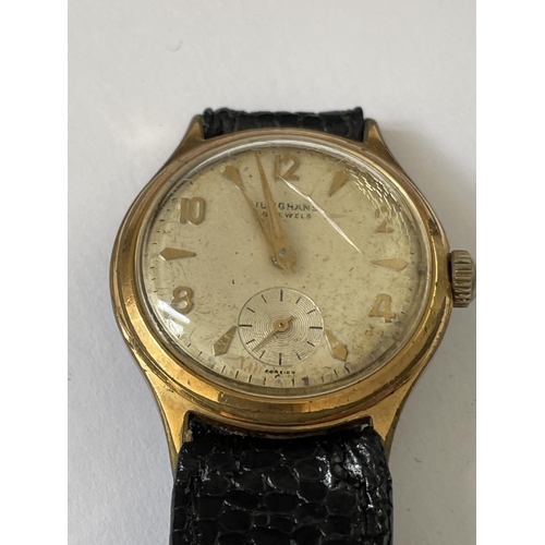 635 - A 1960'S JUNGHANS 16 JEWEL WRIST WATCH WITH SUB DIAL AND BLACK LEATHER STRAP. SEEN WORKING BUT NO WA... 