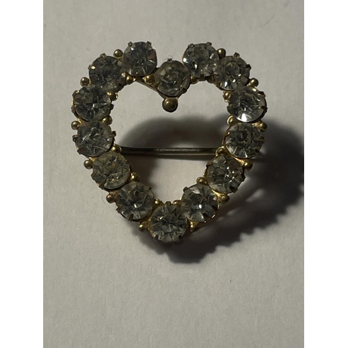 636A - THREE VINTAGE CLEAR STONE ITEMS TO INCLUDE A HEART SHAPED BROOCH AND TWO BUCKLES