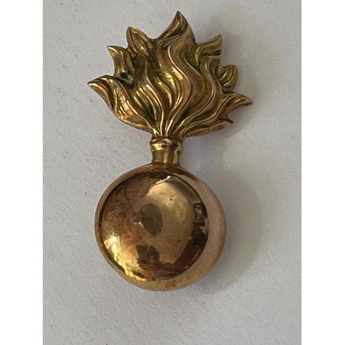 639 - A 9 CARAT GOLD FUSILIERS BROOCH