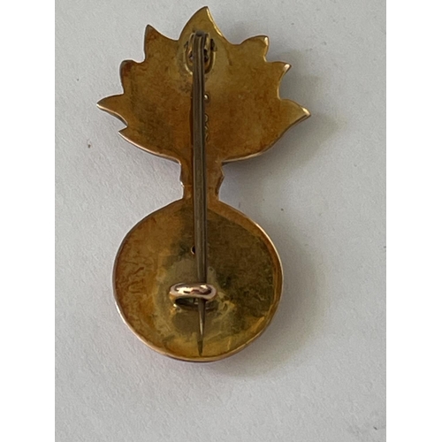 639 - A 9 CARAT GOLD FUSILIERS BROOCH