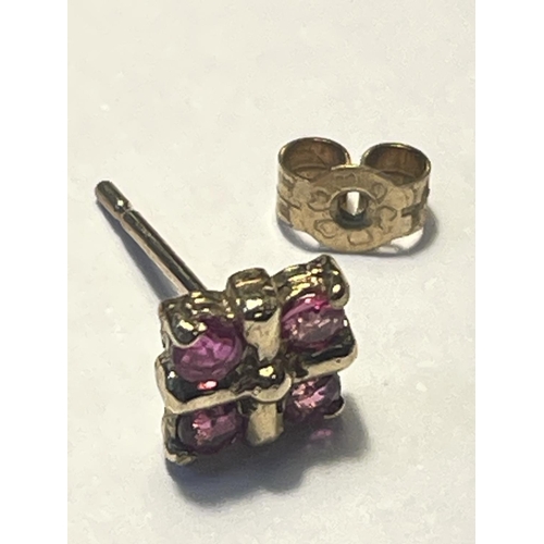 640 - A PAIR OF 9 CARAT GOLD EARRINGS WITH FOUR DEEP PINK STONES IN A SQUARE DESIGN PRESENTED IN A BOX