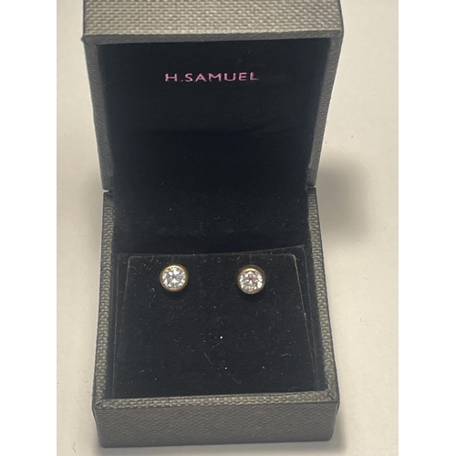 641 - A PAIR OF 9 CARAT GOLD AND CLEARSTONE EARRINGS IN A PRESENTATION BOX