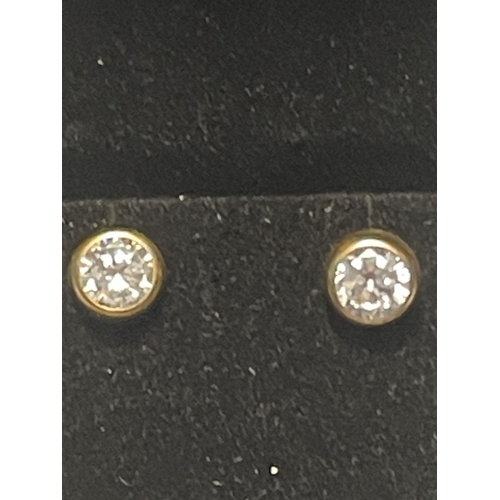 641 - A PAIR OF 9 CARAT GOLD AND CLEARSTONE EARRINGS IN A PRESENTATION BOX