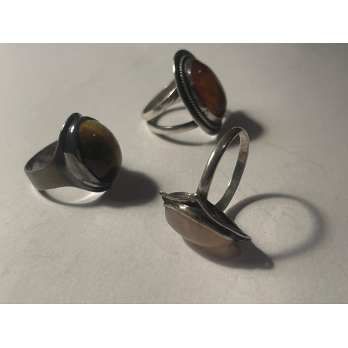 654A - THREE SILVER RINGS WITH LARGE SEMI PRECIOUS STONES