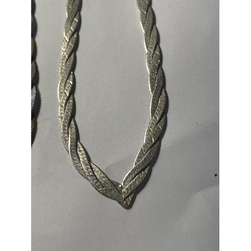 689 - TWO SILVER TWIST FLAT LINK NECKLACES ONE WITH SILVER GILT