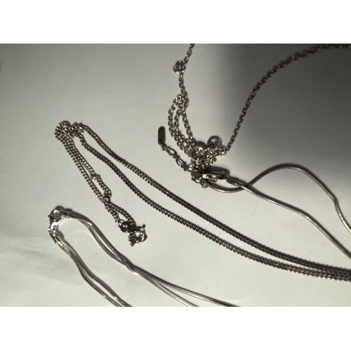 692 - FOUR SILVER NECKLACES WITH PENDANTS