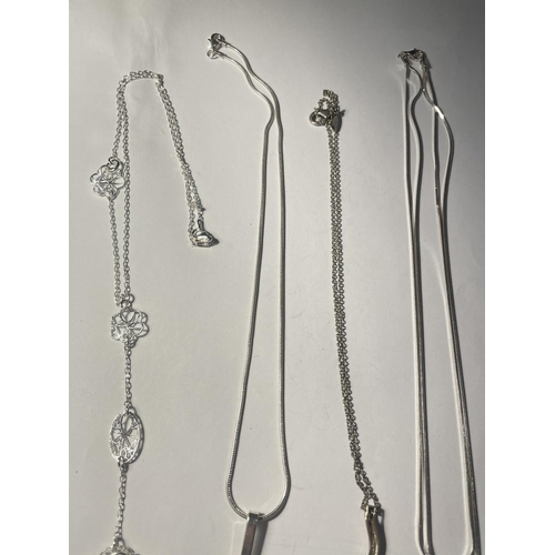 698 - FOUR SILVER NECKLACES WITH PENDANTS