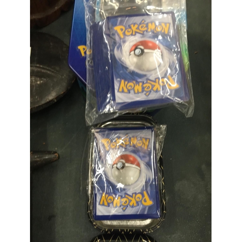 197 - TWO COLLECTORS TINS OF 100+ POKEMON CARDS TO INCLUDE SHINIES AND HOLOS