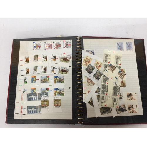 377 - A STAMP ALBUM CONTAINING A LARGE QUANTITY OF BRITISH MINT STAMPS