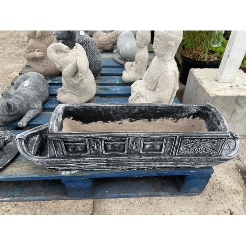 243 - A LARGE CONCRETE GARDEN PLANTER IN THE FORM OF A BARGE 83CM LONG