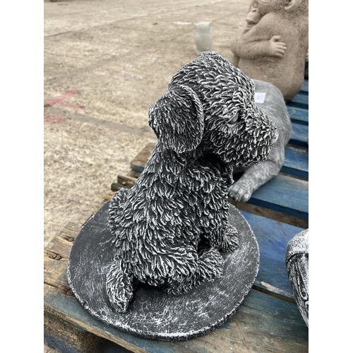 244 - A CONCRETE GARDEN ORNAMENT IN A FORM OF A PUPPY DOG 26CM TALL NO VAT