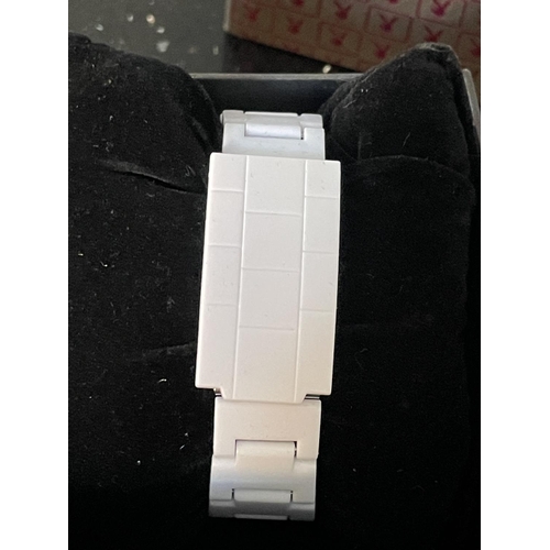 436 - A PLAYBOY WRIST WATCH WITH WHITE STRAP IN A PRESENTATION BOX SEEN WORKING BUT NO WARRANTY