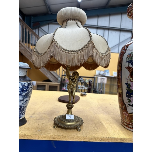 72 - A VINTAGE ORMOLU GILT CHERUB TABLE LAMP AND SHADE