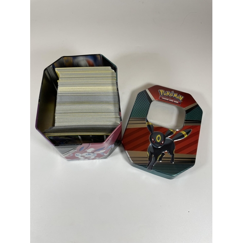 102 - AN UMBREON TIN OF POKEMON TRADING CARDS, HOLOS ETC