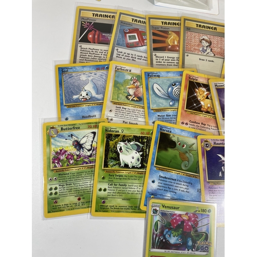 104 - A SMALL FOLDER OF 1999 & LATER WOTC POKEMON CARDS, BASE SET, HOLOS ETC