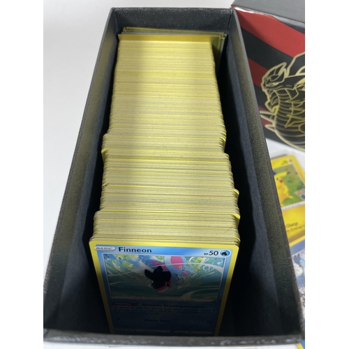 107 - A TRAINER BOX OF ASSORTED POKEMON TRADING CARDS, HOLOS, TOKENS ETC