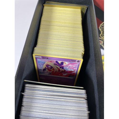 107 - A TRAINER BOX OF ASSORTED POKEMON TRADING CARDS, HOLOS, TOKENS ETC