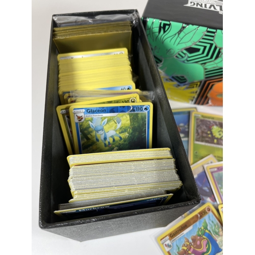 108 - A TRAINER BOX OF ASSORTED POKEMON TRADING CARDS, HOLOS, TOKENS ETC