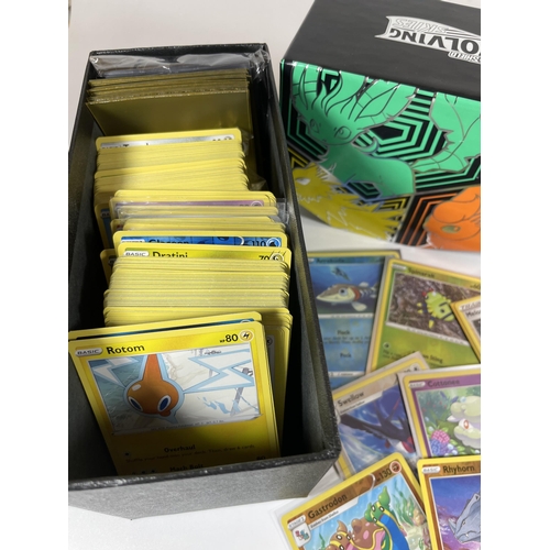 108 - A TRAINER BOX OF ASSORTED POKEMON TRADING CARDS, HOLOS, TOKENS ETC