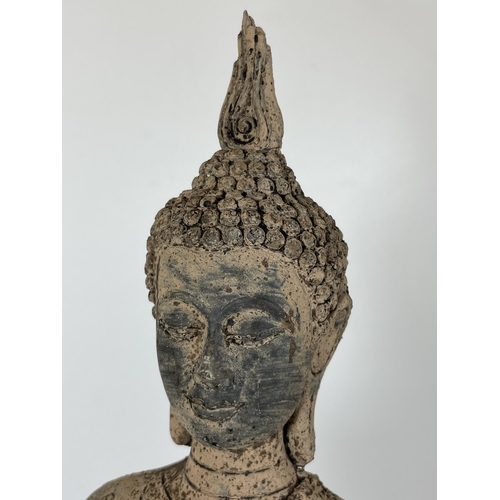 109 - A DECORATIVE STONE BUDDHA ON PLINTH, HEIGHT 39CM