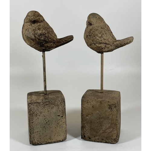 110 - A PAIR OF DECORATIVE STONE BIRDS ON PLINTHS, HEIGHT 24CM