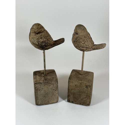 110 - A PAIR OF DECORATIVE STONE BIRDS ON PLINTHS, HEIGHT 24CM