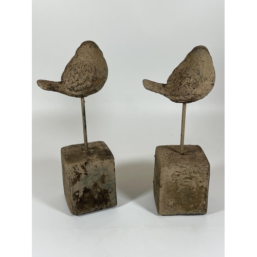 110 - A PAIR OF DECORATIVE STONE BIRDS ON PLINTHS, HEIGHT 24CM