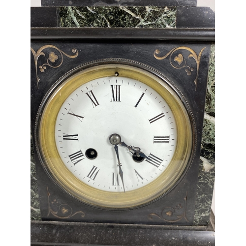 112 - AN ANTIQUE FRENCH MARBLE AND GREEN SLATE CHIMING MANTLE CLOCK WITH PENDULUM