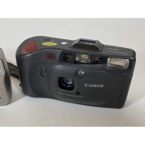 120 - TWO CANON CAMERAS - CANON SURE SHOT BF WITH 32MM LENS AND CANON SURE SHOT ACE WITH 35MM LENS