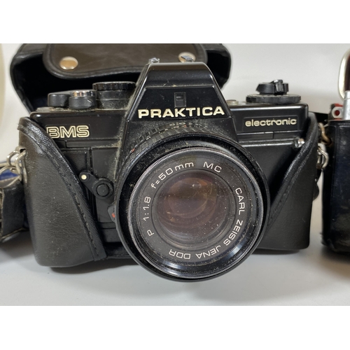 125 - TWO VINTAGE CASED PRAKTICA CAMERAS - PRAKTICA BMS ELECTRONIC FITTED WITH CARL ZEISS JENA DDR 50MM, P... 