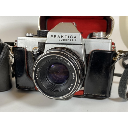 125 - TWO VINTAGE CASED PRAKTICA CAMERAS - PRAKTICA BMS ELECTRONIC FITTED WITH CARL ZEISS JENA DDR 50MM, P... 