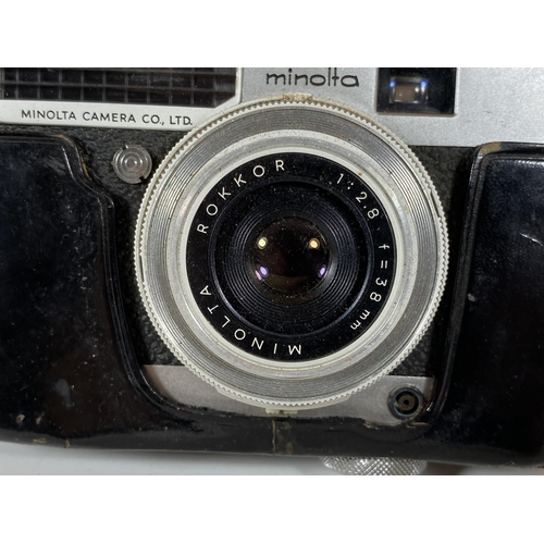 130 - A VINTAGE CASED MINOLTA P CAMERA FITTED WITH ROKKOR 38MM LENS