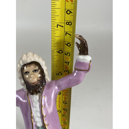 701 - A CONTINENTAL DRESDEN STYLE PORCELAIN MONKEY CONDUCTOR MUSICIAN FIGURE, HEIGHT 17CM