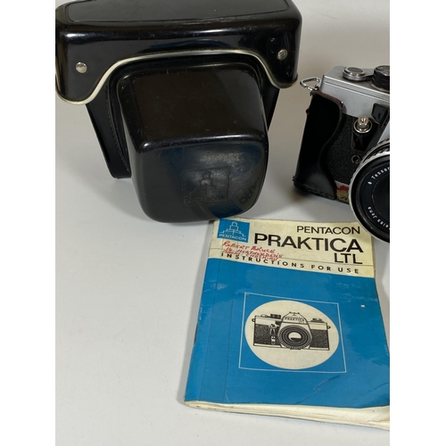 136 - A VINTAGE CASED PRAKTICA LTL CAMERA FITTED WITH CARL ZEISS JENA 2.8/50M LENS AND ORIGINAL BOOKLET